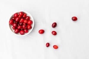 cranberries spilling out of bowl